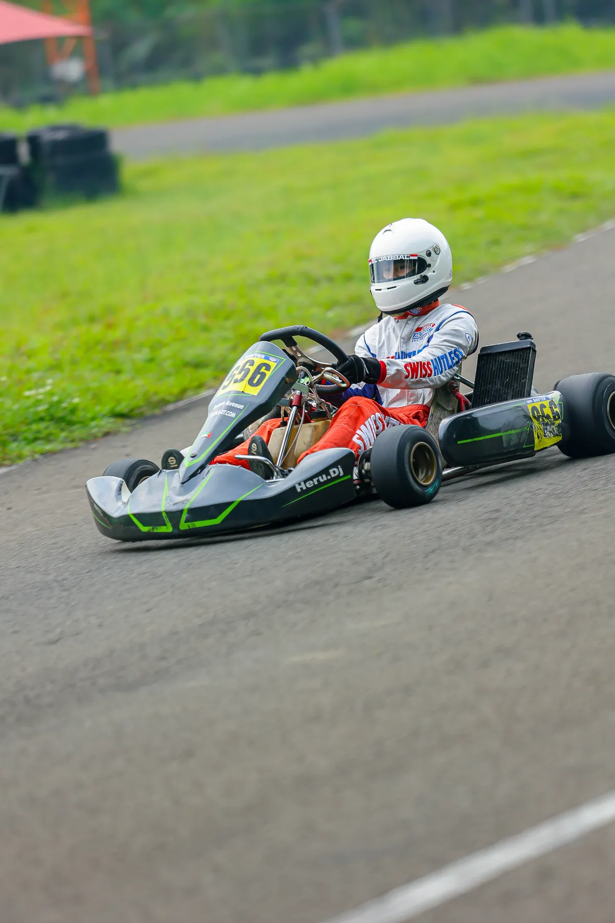 Kart 566 cornering on an outdoor circuit