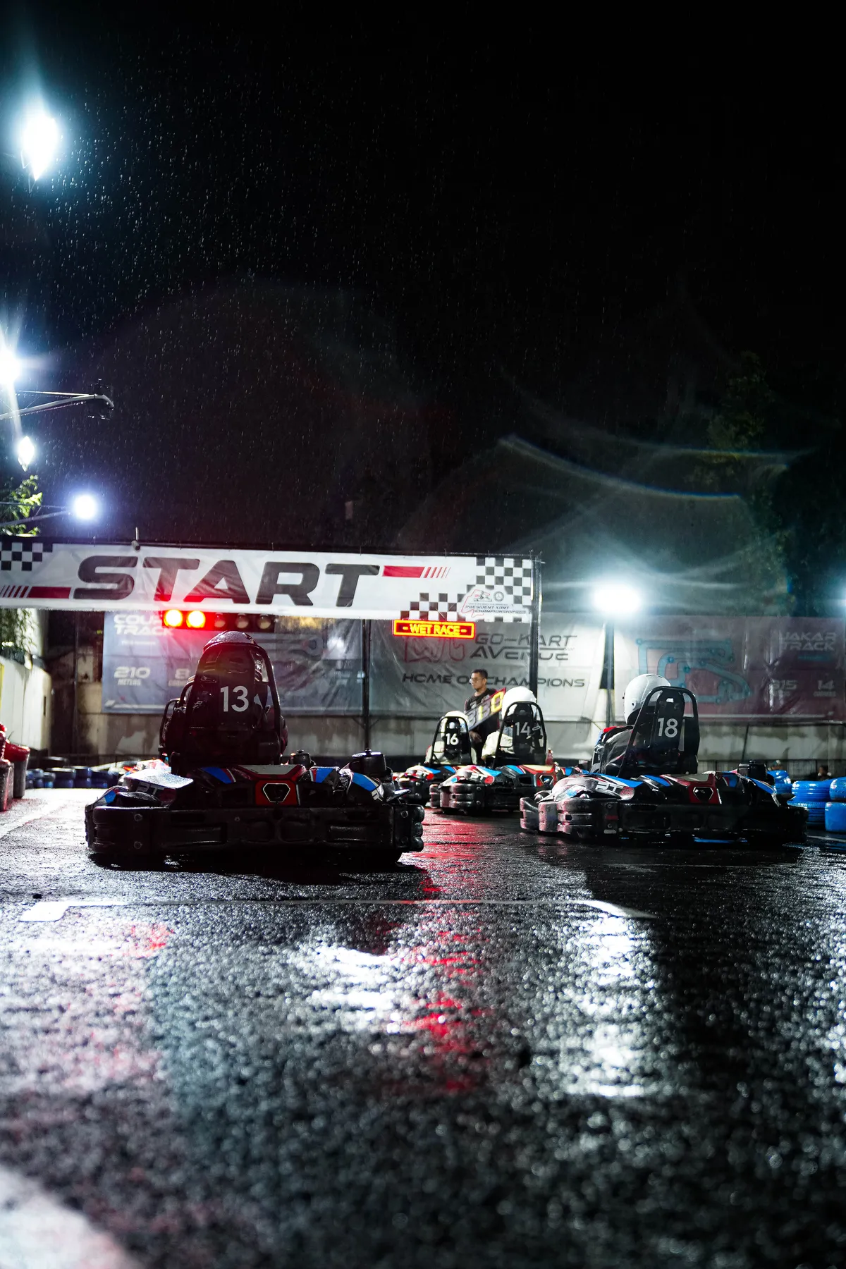 Kart 18 racing in the wet at night