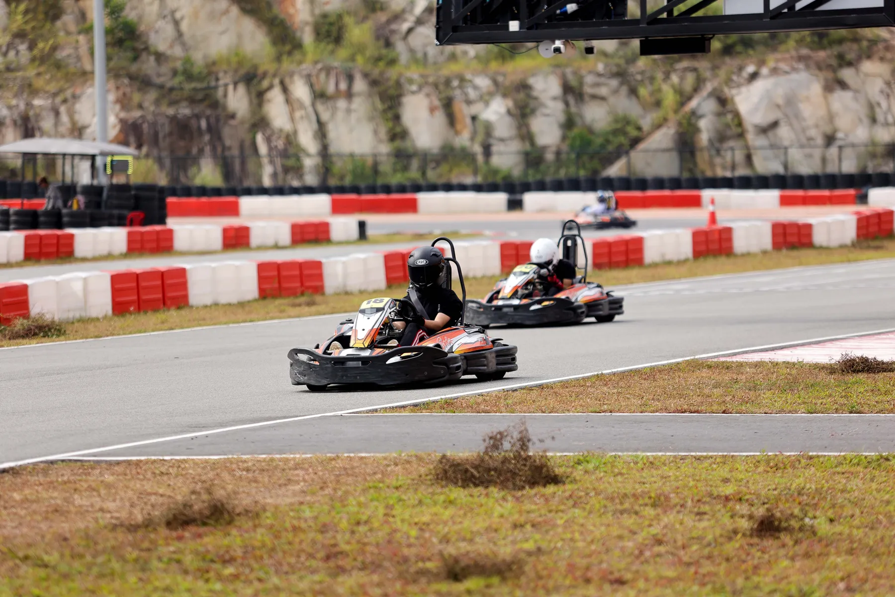 Kart leading through a sweeping corner at Gokart Avenue